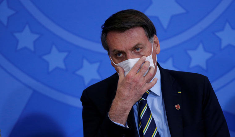 Jair Bolsonaro mask covid19 Reuters